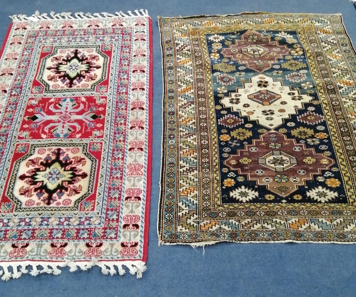 A Caucasian blue ground rug, 141 x 105cm together with one other rug, 57 x 85cm